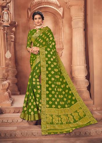 Looking This Lovely Colored Traditional Designer Saree. This Saree?And Blouse Are Fabricated On Chiffon Beautified With Designer Weaving Jari Work. Buy This Pretty Saree Now.