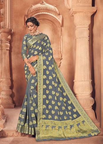 Looking This Lovely Colored Traditional Designer Saree. This Saree?And Blouse Are Fabricated On Chiffon Beautified With Designer Weaving Jari Work. Buy This Pretty Saree Now.