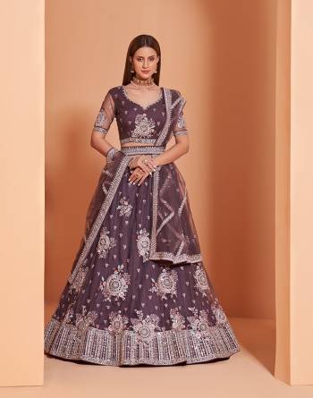 Garb This Designer Wedding Lehenga Choli With Belt In Fine Color Fabricated On Net Beautified Fabric Lahenga Choli With Designer Heavy Thread, Sequance,Coading,Badla Embroidery With Zarkan,Mirror Work.Buy Now. 