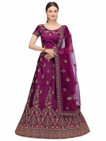 Garb This Partywear Heavy Designer Lehenga Choli And Dupatta In Fine Color Fabricated On Satin Silk Beautified With Heavy Attractive Embroidery Work.Buy Now. 