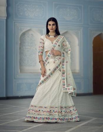 Garb This Wedding Partywear Heavy Designer Lehenga Choli In Fine Light Color Fabricated On Georgette Beautified Fabric With Heavy Designer Embroidery Work.Buy Now. 