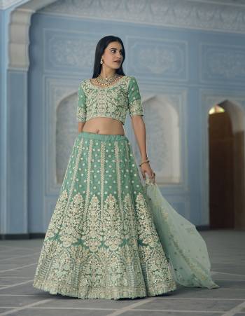 Garb This Wedding Partywear Heavy Designer Lehenga Choli In Fine Light Color Fabricated On Organza Beautified Fabric With Heavy Designer Embroidery Work.Buy Now. 