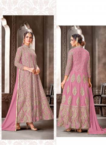 Look Pretty In This Very Beautiful Fancy Straight Suit In Beautifull Color. Its Top Is Net With Santoon Bottom And Nazneen Dupatta.It Is Beautified With Very Pretty Heavy Designer Embroidery Work Which Gives A Subtle Look To It.