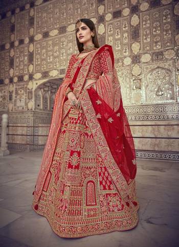 Garb This Heavy Designer Wedding Lehenga Choli In Bridel Color Fabricated On Raw Silk Beautified Fabric Choli And Lahenga Are Silk With Dupatta Are Net Fabric With Designer Heavy Thread, Sequance,Coading,Jari Embroidery With Hand Work.Buy Now. 