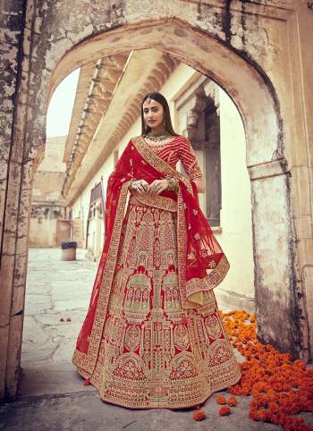 Garb This Heavy Designer Wedding Lehenga Choli In Bridel Color Fabricated On Raw Silk Beautified Fabric Choli And Lahenga Are Silk With Dupatta Are Net Fabric With Designer Heavy Thread, Sequance,Coading,Jari Embroidery With Hand Work.Buy Now. 