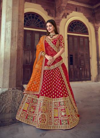 Garb This Heavy Designer Wedding Lehenga Choli In Bridel Color Fabricated On Raw Silk Beautified Fabric Choli And Lahenga Are Silk With Dupatta Are Net Fabric With Designer Heavy Thread, Sequance,Coading,Jari Embroidery With Hand Work.Buy Now. 