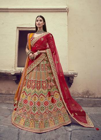 Garb This Heavy Designer Wedding Lehenga Choli In Bridel Color Fabricated On Raw Silk Beautified Fabric Choli And Lahenga Are Silk With Dupatta Are Net Fabric With Designer Heavy Thread, Sequance,Coading,Jari Embroidery With Hand Work.Buy Now. 