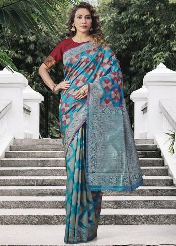 Garb This Partywear Saree Paired With Blouse.This Saree And Blouse Are Lichi Silk Based Fabric With Heavy Wevon Designer Work. Buy This Pretty Saree Now.