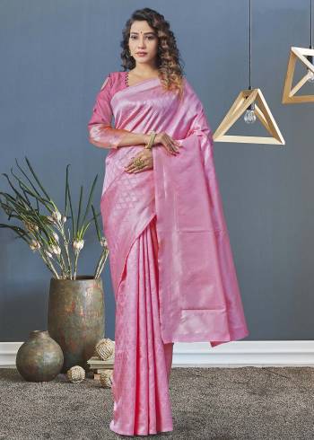 Garb This Partywear Saree Paired With Blouse.This Saree And Blouse Are Lichi Silk Based Fabric With Heavy Wevon Designer Work. Buy This Pretty Saree Now.