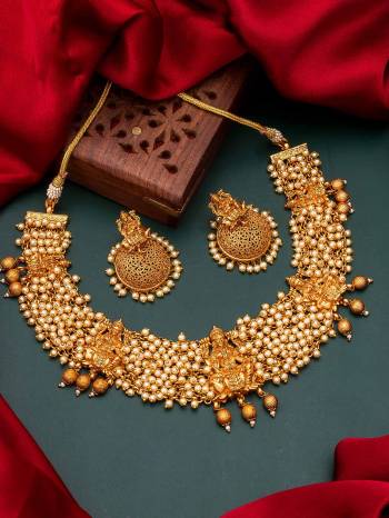 Attrective Look To Your Personality By Pairing Up This Beautiful Necklace With Your Ethnic Attire. This Pretty Set Is In Fine Color Beautified With Temple Work. Buy Now.