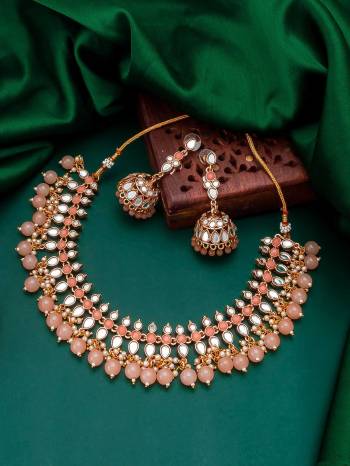 Attrective Look To Your Personality By Pairing Up This Beautiful Necklace With Your Ethnic Attire. This Pretty Set Is In Fine Color Beautified With Stone And Pearl Work. Buy Now.