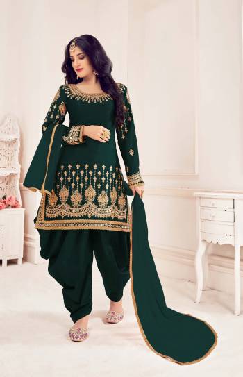 Attrective This Partywear Designer Patiyala Suit In Lovely Color.Its Pretty Designer Embroidery With Real Mirror Work Top Is Bitalian Soft Silk Based Paired With Bitalian Soft Silk Bottom And Net Fabricated Dupatta Which Gives An Attractive To The Suit.