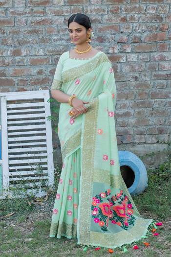 Attrective This Partywear Saree Paired With Blouse.This Saree And Blouse Are Handloom Linen Based Fabric With Heavy Wevon Meenakari Designer Work. Buy This Pretty Saree Now.