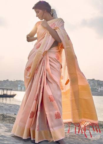 Your Personality In This Lovely Colored Designer Saree. This Saree?And Blouse Are Fabricated On Soft Tissue Linen Beautified With Wevon Rich Jari Designer. Buy This Pretty Saree Now.