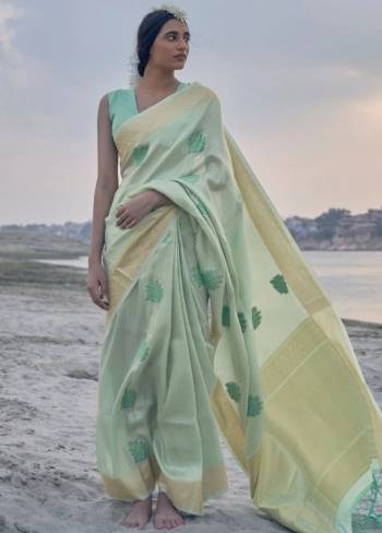 Your Personality In This Lovely Colored Designer Saree. This Saree?And Blouse Are Fabricated On Soft Tissue Linen Beautified With Wevon Rich Jari Designer. Buy This Pretty Saree Now.