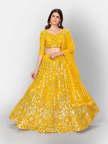 Garb This Partywear Heavy Designer Lehenga Choli And Dupatta In Fine Color Fabricated On Georgette Beautified With Heavy Attractive Thread,Mirror Embroidery Work.Buy Now. 