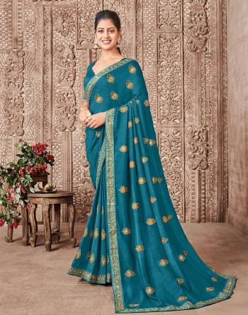 Garb This Designer Partywear Saree Are Fine Saree Paired With Blouse.This Saree And Blouse Are P.C.Vichitra Silk Based Fabric With Designer Jari Embroidery,Stone Work. Buy This Pretty Saree Now.