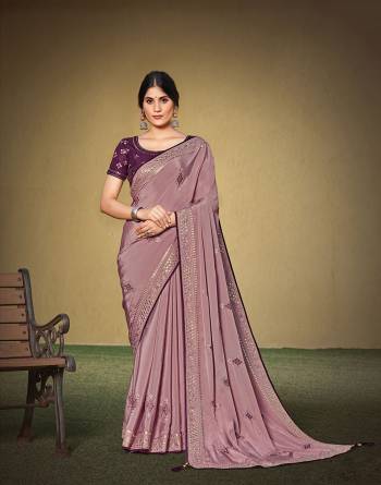 Garb This Partywear Stylist Designer Fine Colour Saree Paired With Blouse.This Saree Are Satin Silk And Blouse Are Raw Silk Fabric With Heavy Designer Embroidery Work. Buy This Pretty Saree Now.