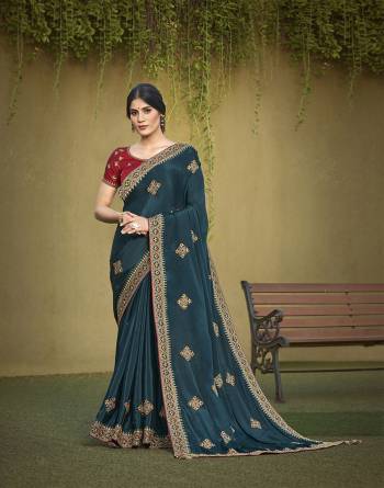 Garb This Partywear Stylist Designer Fine Colour Saree Paired With Blouse.This Saree Are Satin Silk And Blouse Are Raw Silk Fabric With Heavy Designer Embroidery Work. Buy This Pretty Saree Now.