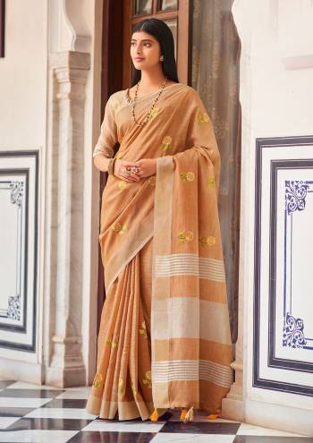 Garb This Traditional Saree Paired With Blouse.This Saree And Blouse Are Linen Based Fabric With Wevon Jari Designer With Embroidery Work. Buy This Pretty Saree Now.