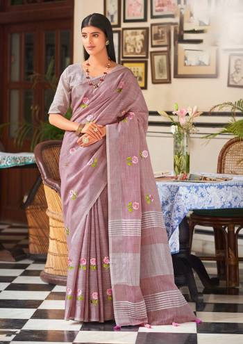 Garb This Traditional Saree Paired With Blouse.This Saree And Blouse Are Linen Based Fabric With Wevon Jari Designer With Embroidery Work. Buy This Pretty Saree Now.