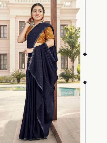 Looking This Designer Partywear Saree Are Fine Saree Paired With Contrasted Blouse.This Saree Are Satin With Stone Work And Blouse Are Art Silk With Sequance Embroidery Work Based Fabric With Designer Saree. Buy This Pretty Saree Now.