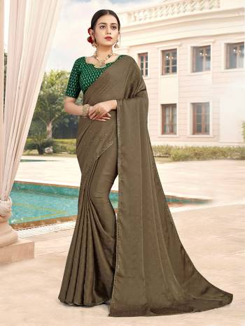 Looking This Designer Partywear Saree Are Fine Saree Paired With Contrasted Blouse.This Saree Are Satin With Stone Work And Blouse Are Art Silk With Sequance Embroidery Work Based Fabric With Designer Saree. Buy This Pretty Saree Now.