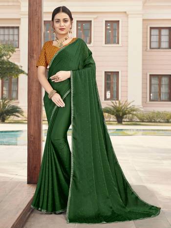 Looking This Designer Partywear Saree Are Fine Saree Paired With Contrasted Blouse.This Saree Are Satin With Stone Work And Blouse Are Art Silk With Sequance Embroidery Work Based Fabric With Designer Saree. Buy This Pretty Saree Now.