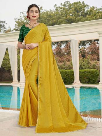 Looking This Designer Partywear Saree Are Fine Saree Paired With Contrasted Blouse.This Saree Are Satin With Stone Work And Blouse Are Art Silk With Sequance Embroidery Work Based Fabric With Designer Saree. Buy This Pretty Saree Now.