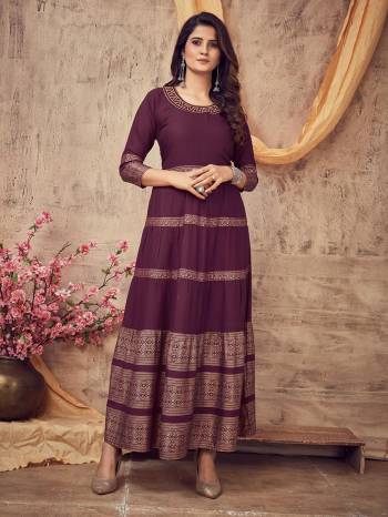 Flaunt Your Rich And Elegant Taste Wearing This Designer Readymade Long Gown In Dark Color. This Pretty Gown Is Fabricated On Rayon Beautified With Designer Printed With Neck Embroidery Work. Its Fabric Is Soft Towards Skin And Easy To Carry All Day Long. 