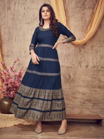 Flaunt Your Rich And Elegant Taste Wearing This Designer Readymade Long Gown In Dark Color. This Pretty Gown Is Fabricated On Rayon Beautified With Designer Printed With Neck Embroidery Work. Its Fabric Is Soft Towards Skin And Easy To Carry All Day Long. 