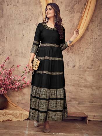 Flaunt Your Rich And Elegant Taste Wearing This Designer Readymade Long Gown In Dark Color. This Pretty Gown Is Fabricated On Rayon Beautified With Designer Printed With Neck Embroidery Work. Its Fabric Is Soft Towards Skin And Easy To Carry All Day Long. 