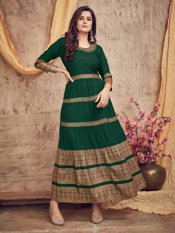 Flaunt Your Rich And Elegant Taste Wearing This Designer Readymade Long Gown In Dark Color. This Pretty Gown Is Fabricated On Rayon Beautified With Designer Printed With Neck Embroidery Work. Its Fabric Is Soft Towards Skin And Easy To Carry All Day Long. 