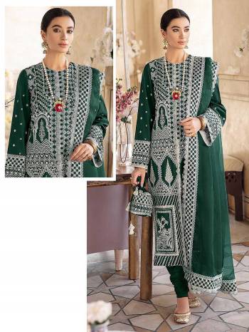 Look Attrctive This Designer Pakistani Suit In Dark Color.Its Pretty Heavy Designer Embroidery Work Top Is Faux Georgette Based Paired With Santoon Bottom And Net Fabricated Dupatta Which Gives An Attractive To The Suit.