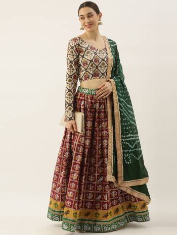 Attrective This Partywear Heavy Designer Lehenga Choli And Dupatta In Fine Color. Its Preety Choli Are Cotton,Lahenga Are Patola Silk With Dupatta Are Bandhej Silk Fabricated On Beautified With Heavy Attractive Printed And Wevon Patala Designer.Buy Now. 