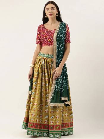 Attrective This Partywear Heavy Designer Lehenga Choli And Dupatta In Fine Color. Its Preety Choli Are Cotton,Lahenga Are Patola Silk With Dupatta Are Bandhej Silk Fabricated On Beautified With Heavy Attractive Printed And Wevon Patala Designer.Buy Now. 