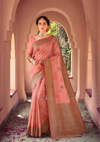 Garb This Traditional Saree Paired With Blouse.This Saree And Blouse Are Soft Cotton Based Fabric With Heavy Wevon Designer Work. Buy This Pretty Saree Now.