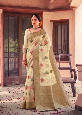 Garb This Traditional Saree Paired With Blouse.This Saree And Blouse Are Soft Cotton Based Fabric With Heavy Wevon Designer Work. Buy This Pretty Saree Now.