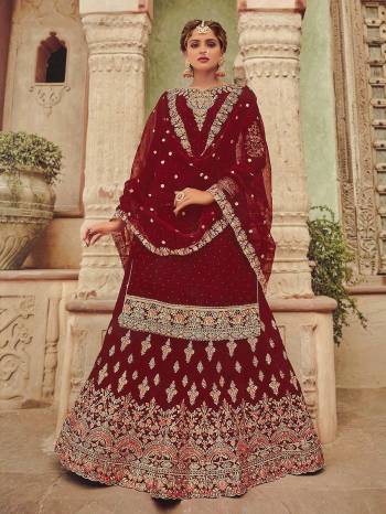 Garb This Designer Wedding Sharara Suit In Fine Color.Its Pretty Heavy Designer Embroidery With Diamond Work Top Is Georgette Based Paired With Georgette Bottom And Soft Net Fabricated Work Dupatta Which Gives An Attractive To The Suit.Buy Now.