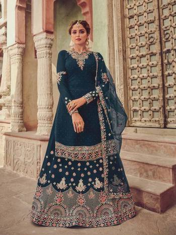 Garb This Designer Wedding Sharara Suit In Fine Color.Its Pretty Heavy Designer Embroidery With Diamond Work Top Is Georgette Based Paired With Georgette Bottom And Soft Net Fabricated Work Dupatta Which Gives An Attractive To The Suit.Buy Now.