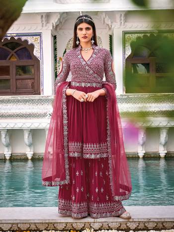 Attrective This Designer Sharara Suit In Fine Color.Its Pretty Heavy Designer Embroidery Work Top Is Georgette Based Paired With Georgette Bottom And Soft Net Fabricated Dupatta Which Gives An Attractive To The Suit.