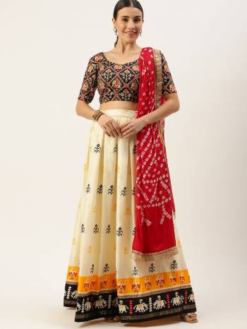 Garb This Partywear Heavy Designer Lehenga Choli And Dupatta In Fine Color. This Lahenga Choli Are Cotton And Dupatta Are Bandhej Silk Fabricated On Beautified With Attractive Bandhej With Foil Printed.Buy Now. 