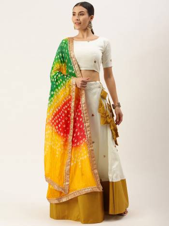 Garb This Partywear Heavy Designer Lehenga Choli And Dupatta In Fine Color. This Lahenga Choli Are Cotton And Dupatta Are Bandhej Silk Fabricated On Beautified With Attractive Paper Mirror Work With Bandhej Printed.Buy Now. 