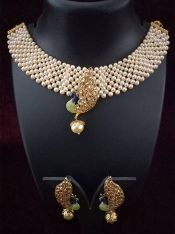 Attrective Look To Your Personality By Pairing Up This Beautiful Necklace With Your Ethnic Attire. This Pretty Set Is In Fine Color Beautified With Kundan And Moti Work. Buy Now.