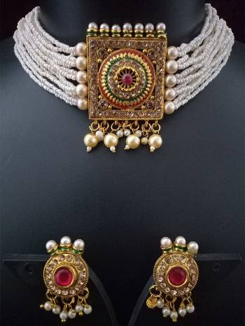 Attrective Look To Your Personality By Pairing Up This Beautiful Necklace With Your Ethnic Attire. This Pretty Set Is In Fine Color Beautified With Kundan And Moti Work. Buy Now.