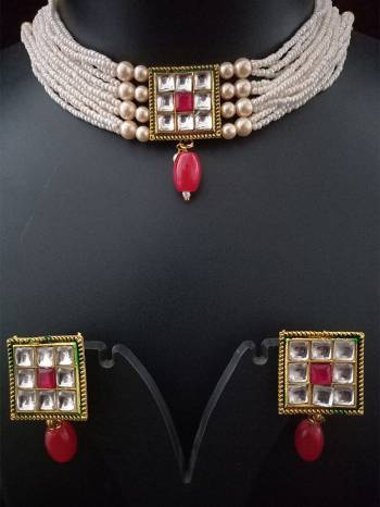 Attrective Look To Your Personality By Pairing Up This Beautiful Necklace With Your Ethnic Attire. This Pretty Set Is In Fine Color Beautified With Kundan And Moti Work. Buy Now.