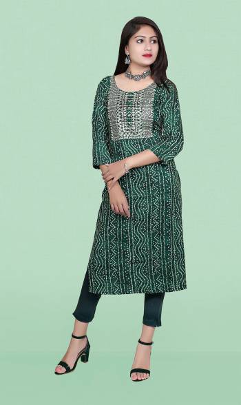 Attrective This Readymade Long Kurti In Fine Color Fabricated On Rayon Beautified With Bandhani Printed Designer With Embroidery Work. It Is Light In Weight And Easy To Carry All Day Long. 