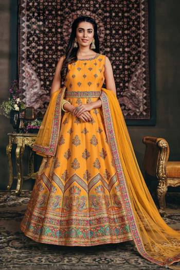 Flaunt Your Rich And Elegant Taste Wearing This Designer Readymade Long Gown With Dupatta In Fine Color. This  Pretty Gown Is Jacquard Silk And Dupatta Are Net Fabricated Beautified With Heavy Multy Color Wevon Jacquard Designer. Its Fabric Is Soft Towards Skin And Easy To Carry All Day Long. 