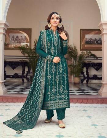 Looking This Designer Suits In Lovely Color.?Its Pretty Heavy Weaving Jacquard Designer Top Is Viscose Dola Silk Based Paired Bottom Dull Santoon With Viscose Dola Silk Fabricated Dupatta Which Gives An Attractive To The Dress.