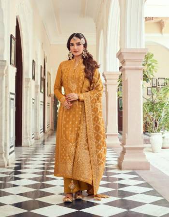 Looking This Designer Suits In Lovely Color.?Its Pretty Heavy Weaving Jacquard Designer Top Is Viscose Dola Silk Based Paired Bottom Dull Santoon With Viscose Dola Silk Fabricated Dupatta Which Gives An Attractive To The Dress.